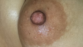 A close-up of my oiled up nipple by request ;)