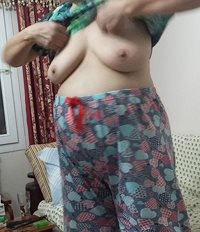 Here is a photo of a mature lady I've seen recently.. Would you suck her ti...