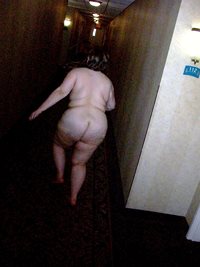 Naked in motel hallway.