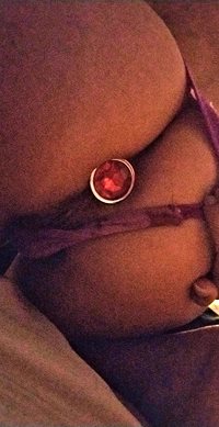 Pulling panties aside and showing off my plug. Sorry about the poor quality