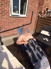Wife bathing topless for the neighbours