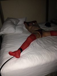 On the bed tied up and ready. Please read my Halloween After Party blog her...