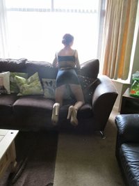 A slim slut shows her dwelling to you.