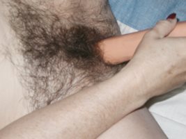 Like the close up of this hairy pussy getting toyed - even if a bit blurry?