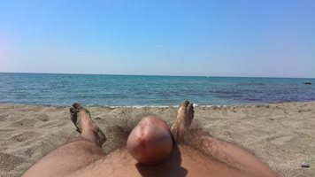 Lying nude in the sun