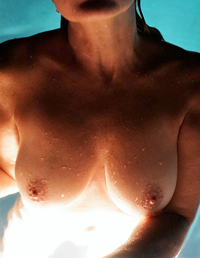 Kristi's nipples while skinny dipping.
