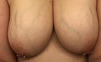 Just another of the wife's pierced nipples.