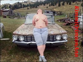 Posing with an old car