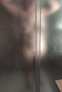 Showering.... Guess what is behind that door....