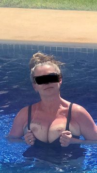 Boobs out in the pool