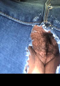 Wife’s pussy at work in crotchless jeans.