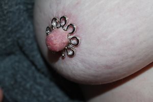 Playing with fake nipple rings