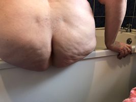 bum that needs to fucked on the side of the bath.