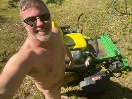 My sexy man driving the lawn tractor!