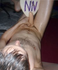 A partial body view toy playing with my right leg crossed over as I play up...