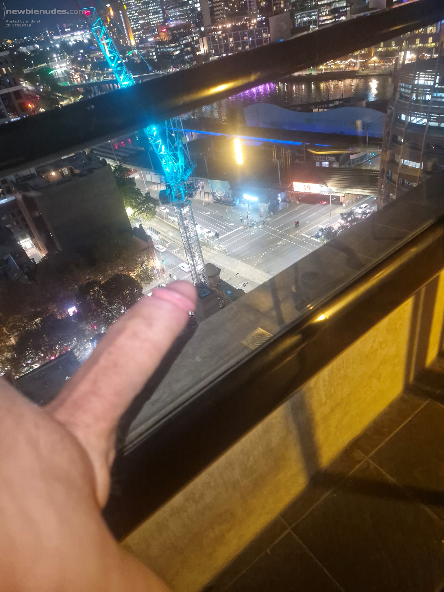 Catching some fresh air early evening on inner city hotel balcony