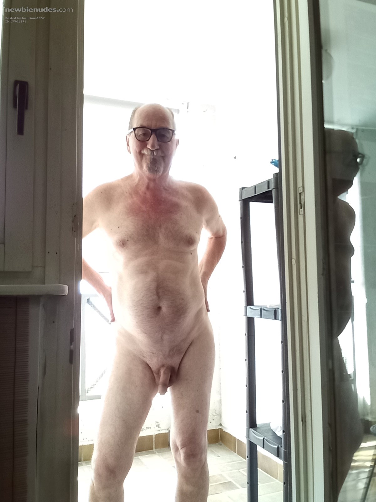 Naked on balcony for all to see