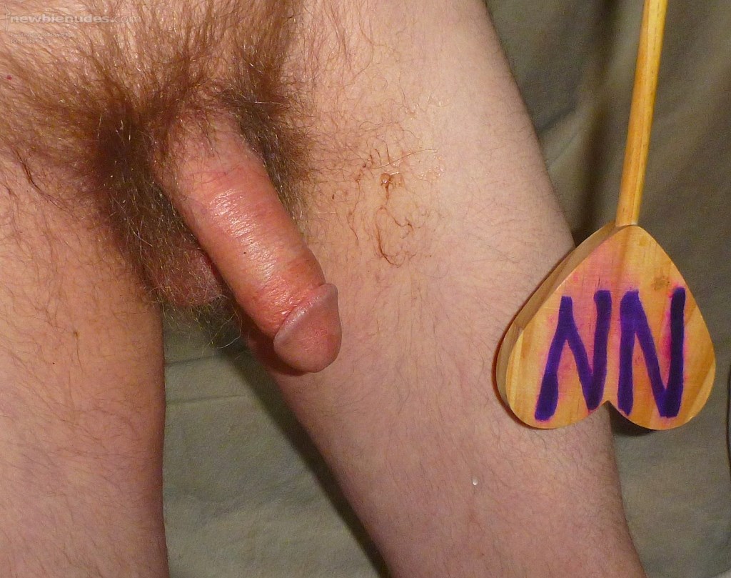 I am still hard as I stand with my fluid scattered about my skin... My dick is still a redwood color after rubbing tong balm upon it... in late April 2025.