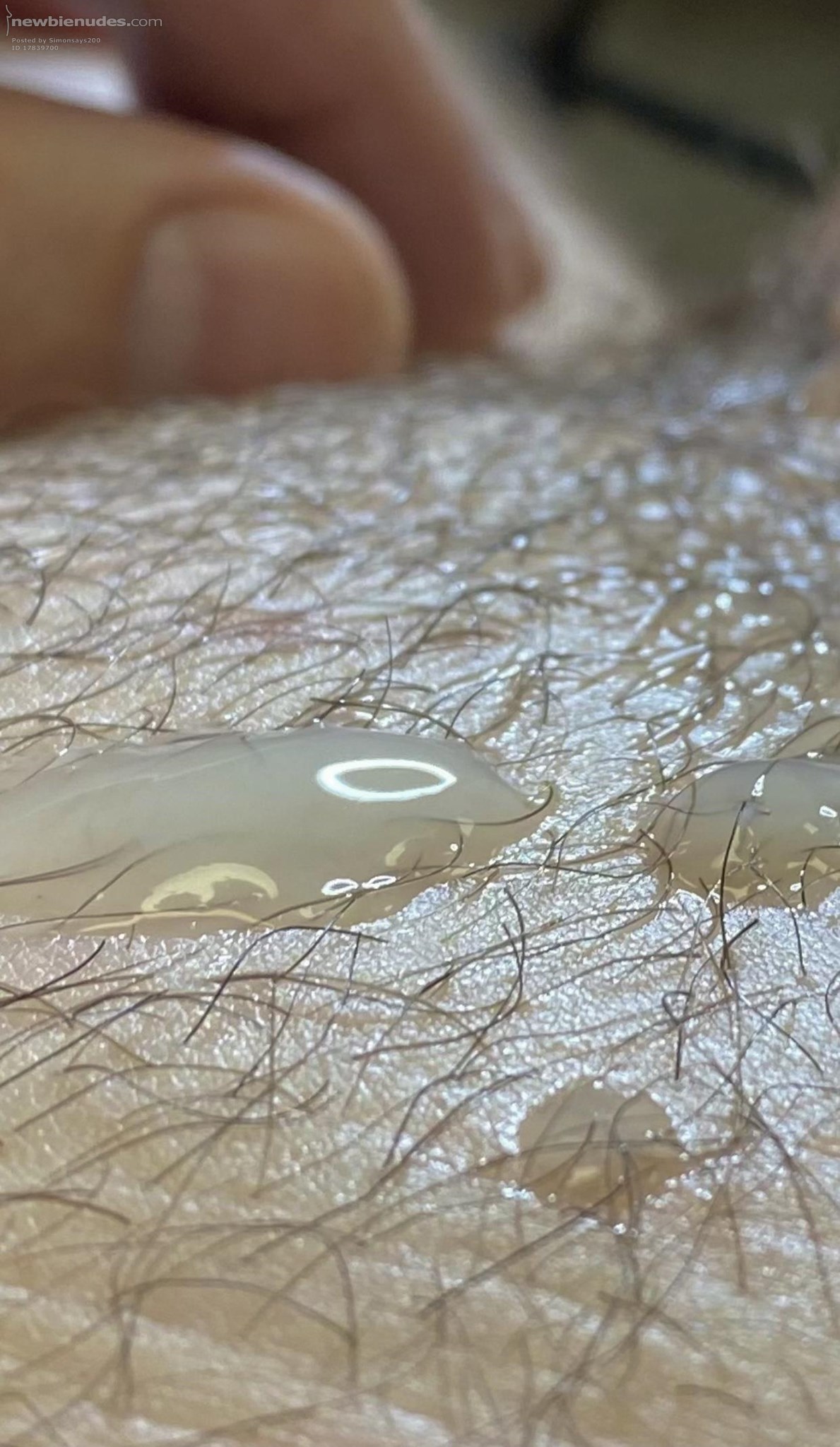 Artistic close up of cum on pubic mound