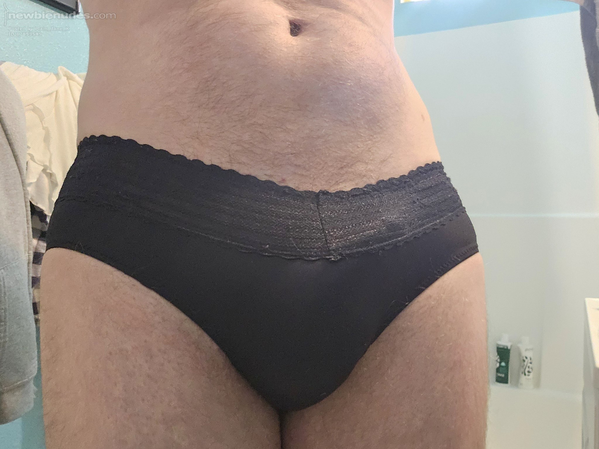Black panties with lace fringe.