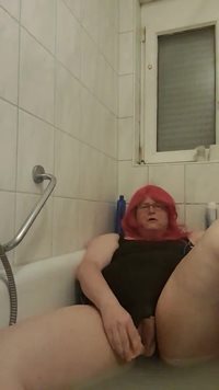 Slut is masturbating in bathtube