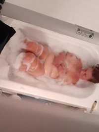 Sonja playing with her tits in the bath