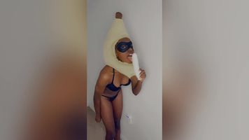 Chocolate banana girl sucking dildo