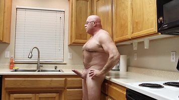Naked and hard in the kitchen.