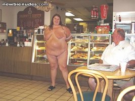 Flashing a stranger in a dount shop (One of my first public nudes)