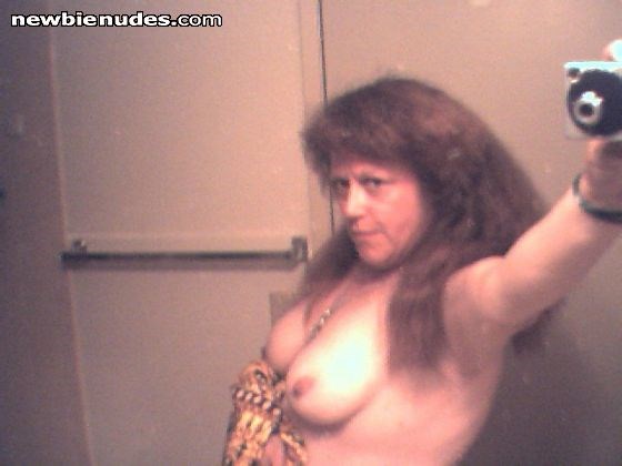 taking a pic, trying to look sexy and damned if this ain't making me horny