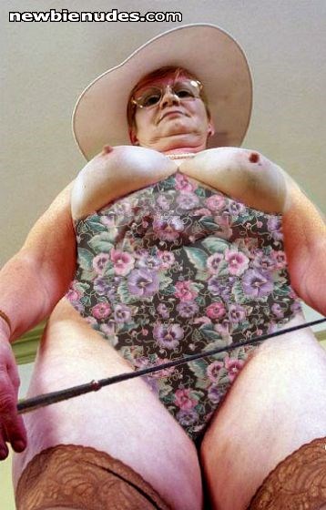 Frau S. - Mrs. S. She is wearing
a thight one piece swimsuit and teaches me, how to behave in her bedroom. (See blog)