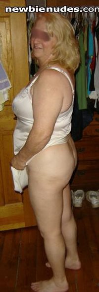 Stripping down. A profile view of me. Hubby has a special thing for my fat ...