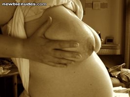 27 week pregnant belly and breasts