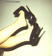 dangling those sexy high heel pumps just to tease