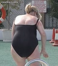 Wife in black swimsuit