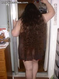 My wife, showing off her long hair in her baby-doll nightgown.  Do you like...