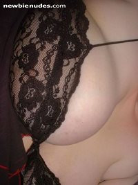 My wife's boob in her baby-doll nightgown.