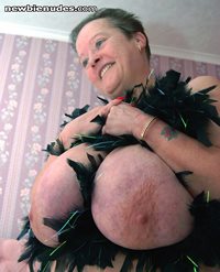 big tits wrapped in a feather boa