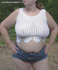DeDe in one of her see thru tops and a short jean skirt.