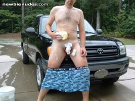 Washing the truck in the nude...