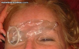 Slut Wife displaying another used condom on her face after guy #4 used her ...
