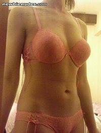 my GF's new pink lingeries. what do you think about her body? plz make comm...
