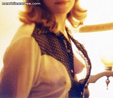 Young exhibitionist shared wife braless in an open blouse that was worn in ...