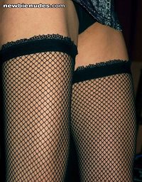 thighs in fishnet stockings