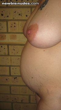14 weeks in these pics. Breasts just keep getting bigger and bigger. :)