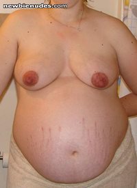 Wife nine months pregnant. Notice her dark nipples.