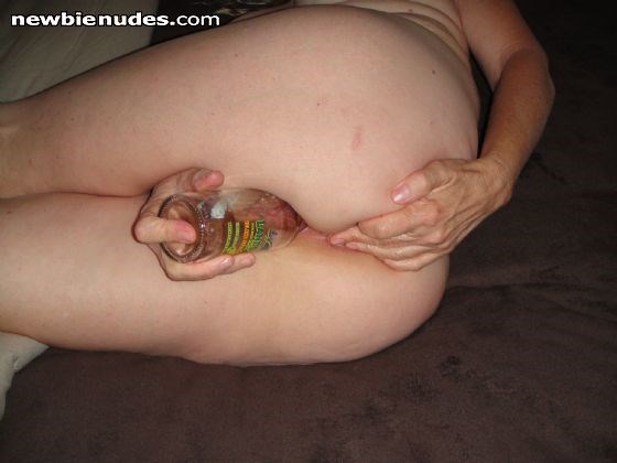 Bottle deep in my pussy. Do you like it? PM's welcome