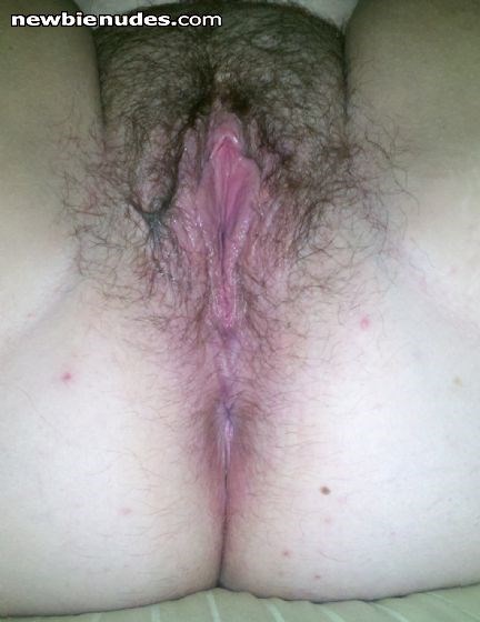 close up of her juicy hairy pussy. I just love to bury my face in that thing for hours.