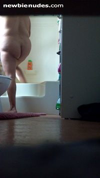 Wife stepping into shower