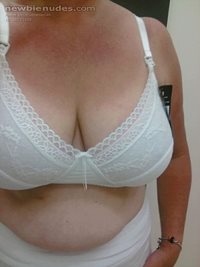 trying on new white maternity bras